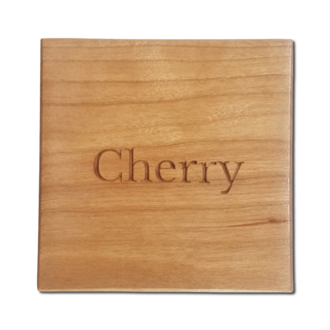 Solid cherry hardwood block labeled “Cherry” showing the natural color and grain of the wood