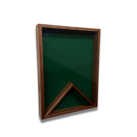 Walnut 18x24 vertical shadow box shown at a slight left angle with green felt backing and no flag displayed