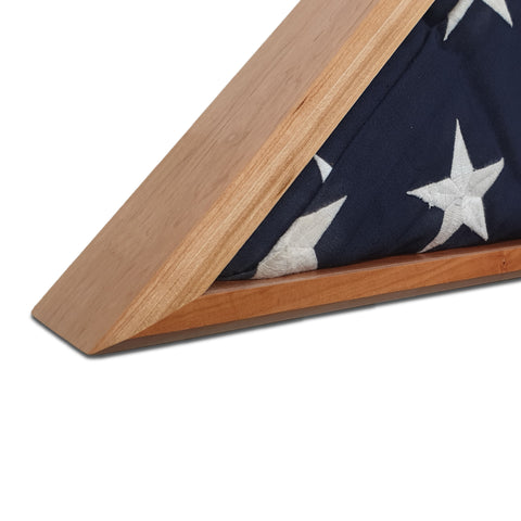 Burial Memorial Flag Display Case for deceased Veteran. Holds one folded 5' by 9.5' burial flag. Made with real Cherry hardwood. American Made - Veteran Built. Zoomed in shot of bottom mitered joints of Burial flag display case.