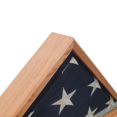 Close-up of Oak hardwood frame and folded burial flag inside display case