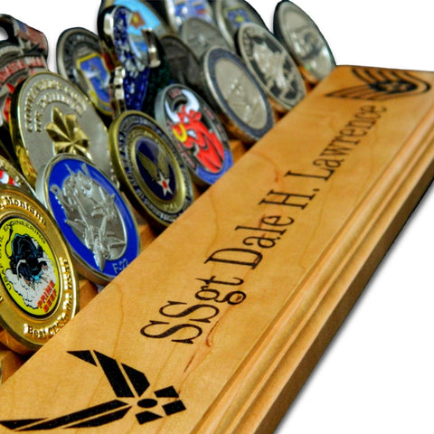 Close-up of personalized engraving on The Sentinel challenge coin display with coins
